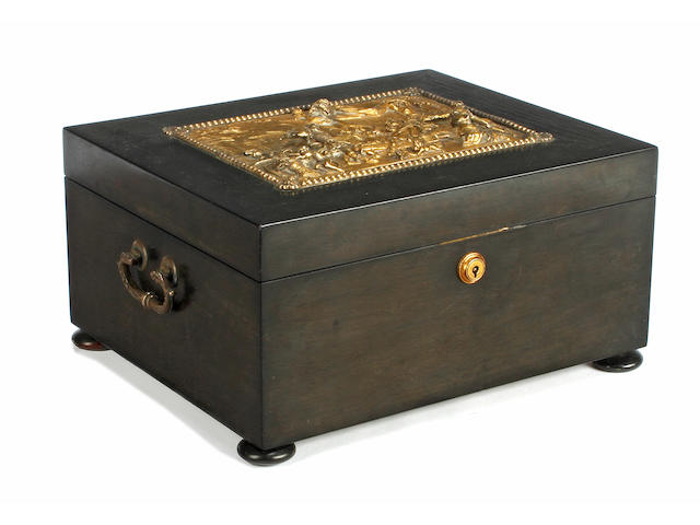 A mid 19th century ebony and gilt sewing box