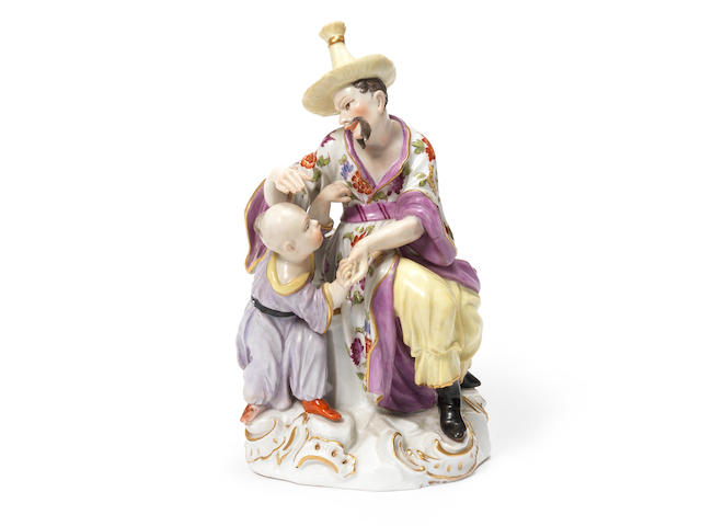A Meissen Chinoiserie group of a man and child, circa 1750