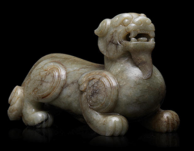 A rare striated pale green jade carving of a bixie Ming Dynasty or later (2)