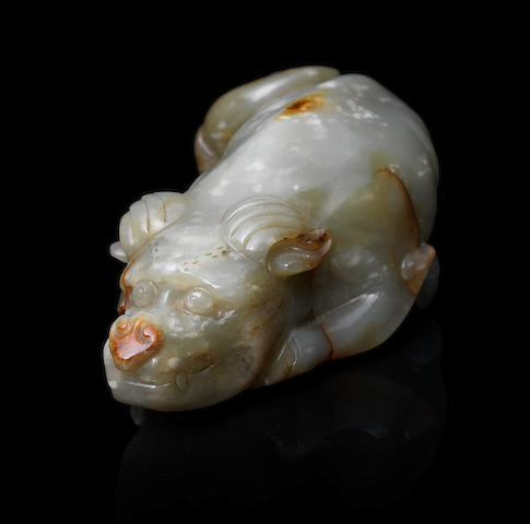 A pale green and russet jade carving of a dog Ming Dynasty, 16th/17th century (2)