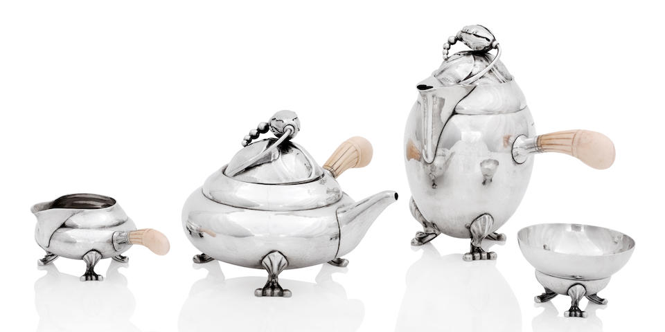 Georg Jensen; A Blossom pattern four piece silver tea service The teapot, cream jug and sugar bowl 1925-1932, the hot water pot 1933-1944, each numbered