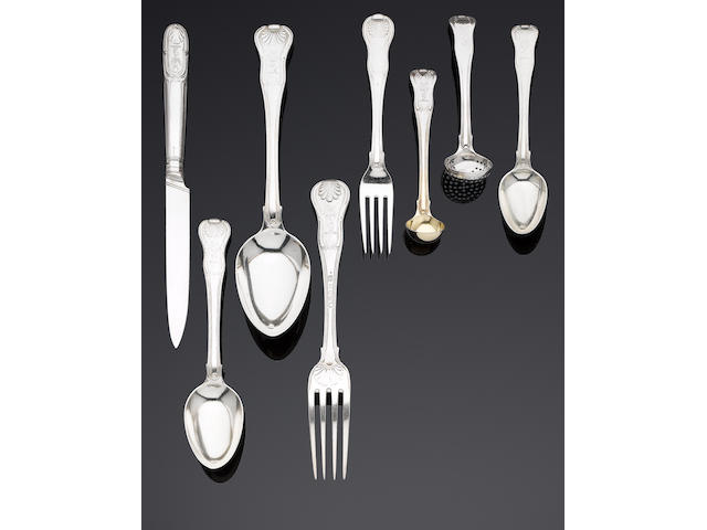 An extensive George III silver Hour Glass pattern table service of flatware and cutlery by William Eley, William Fearn & William Chawner, London 1808, knives by Moses Brent, London 1808 (304)