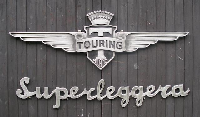 Two garage display emblems for 'Carrozzeria Touring Milano' and 'Superleggera',