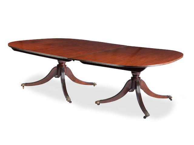 A Large Regency and later mahogany triple pedestal dining table