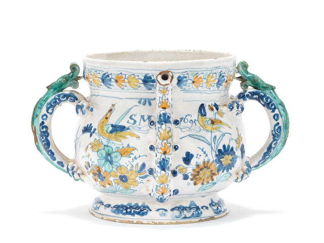 An important English delftware polychrome posset pot, dated 1695
