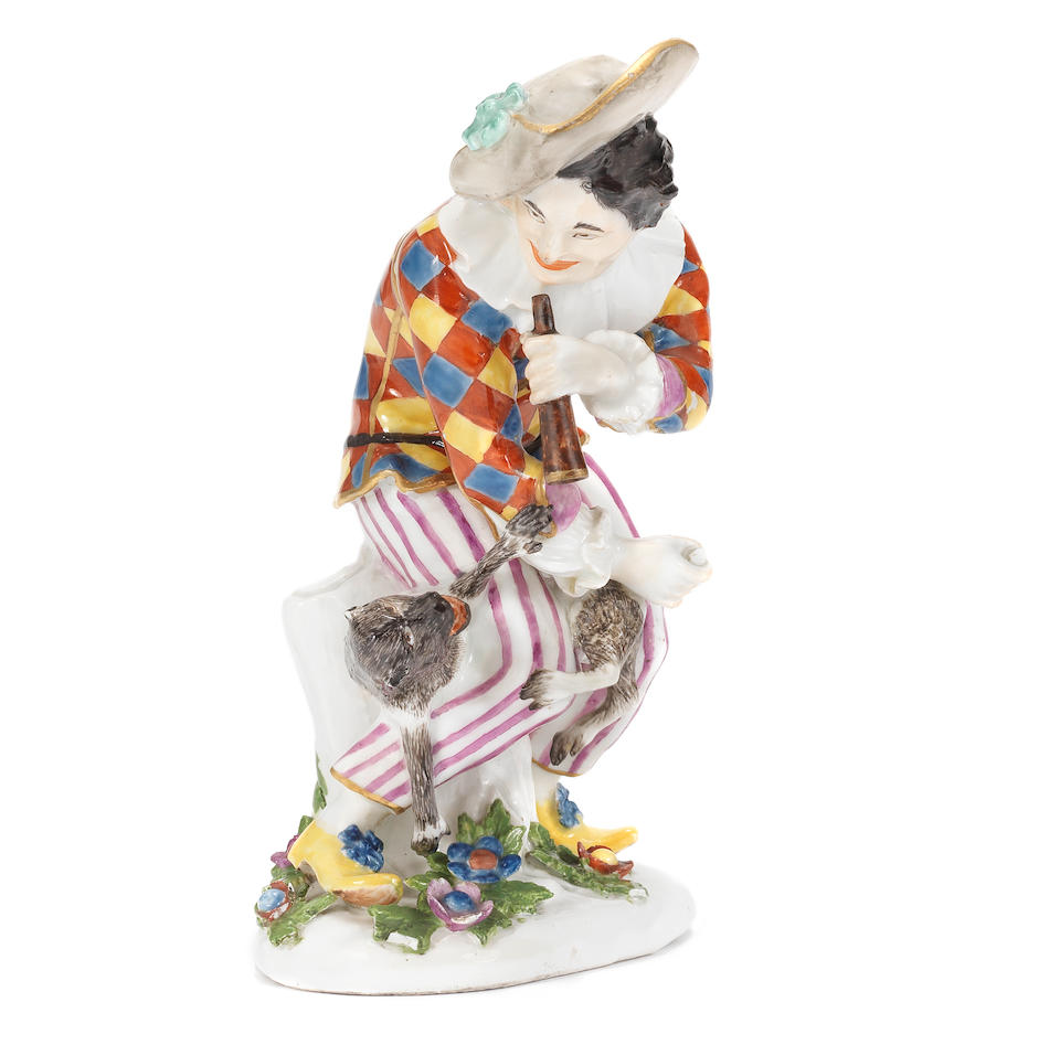 A rare Meissen figure of Harlequin with a monkey, circa 1740