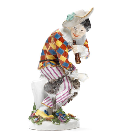 A rare Meissen figure of Harlequin with a monkey, circa 1740