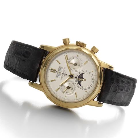 Patek Philippe. A fine and rare 18ct gold manual wind chronograph wristwatch with perpetual calendar and moon phases together with original Certificate of Origin, setting tool and Patek Philippe box  Ref:3970E, Movement No.875693, Circa 1996