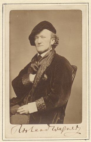 WAGNER (RICHARD) Photograph of Wagner, signed ("Richard Wagner") on the lower mount, showing him three-quarter length, facing to his right and attired in his characteristic velvet jacket and cap, [studio of Pierre-Louis Pierson, Paris, between 28 October and 4 November 1867]