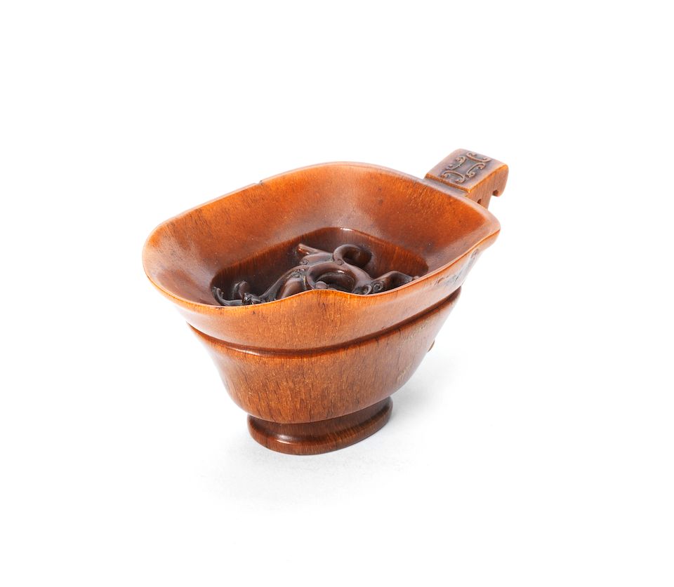 A fine and rare rhinoceros horn 'chilong' libation cup 18th century