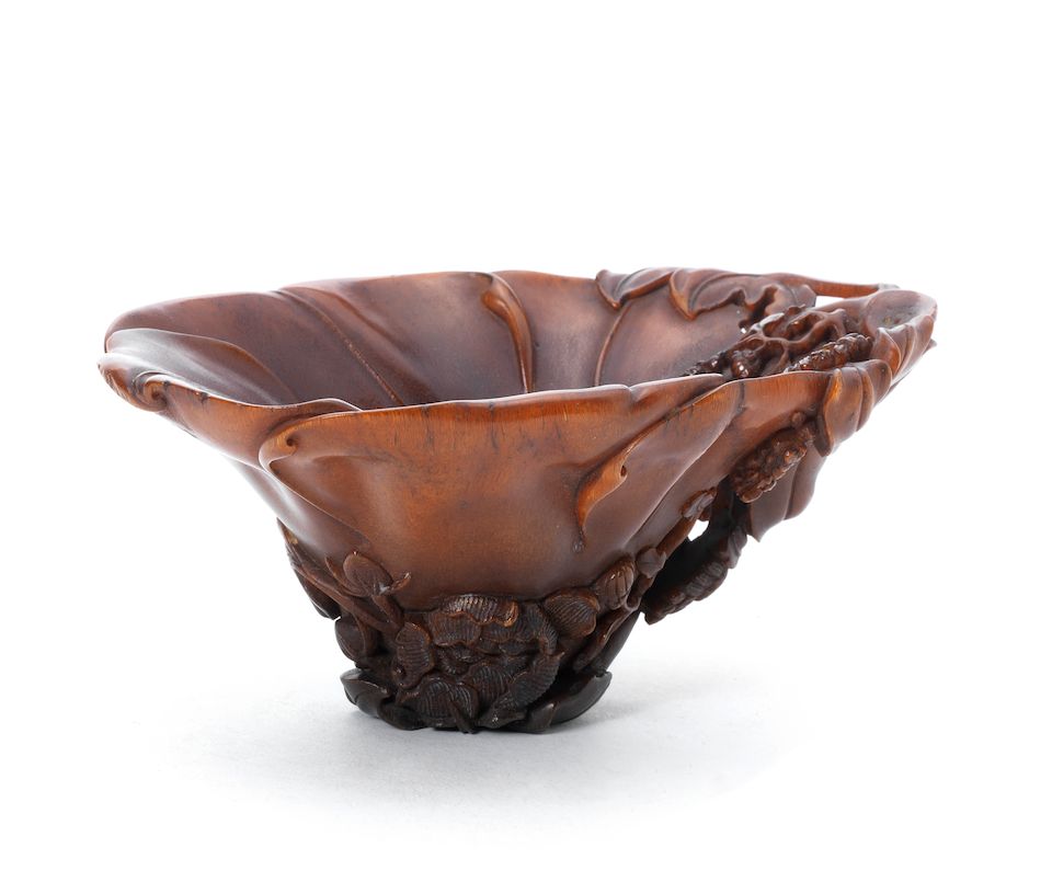A finely carved 'floral' rhinoceros horn libation cup 18th century