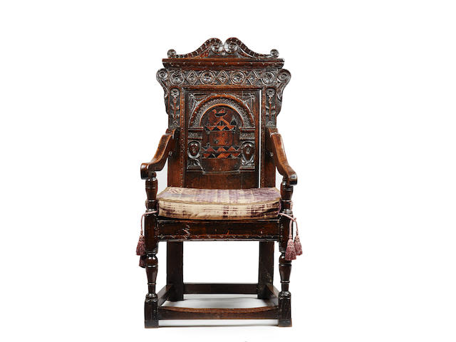 A fascinating and rare Charles I oak and inlaid joined panel-back open armchair, Yorkshire/Derbyshire, dated 1631