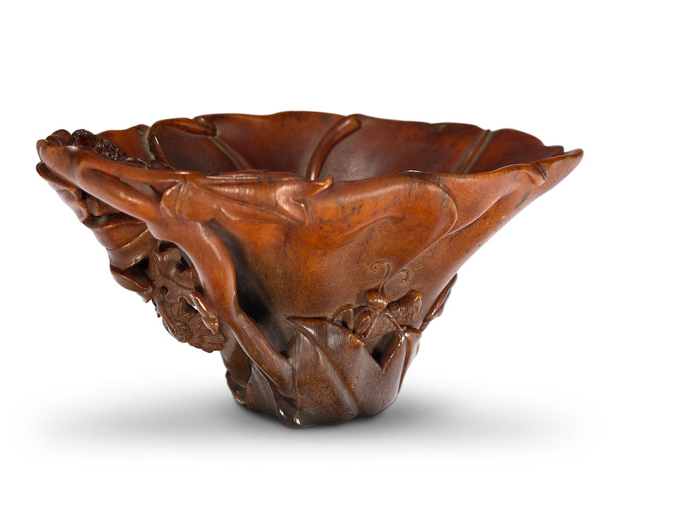 A finely carved 'floral' rhinoceros horn libation cup 18th century