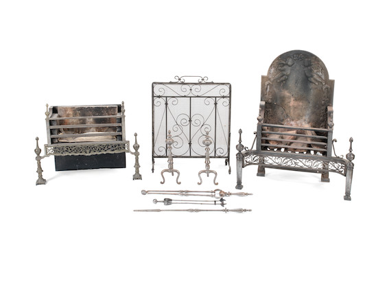 Two steel and cast-iron firegrates together with a mesh firescreen, a pair of steel fire dogs and three steel fire tools  (7) image 1
