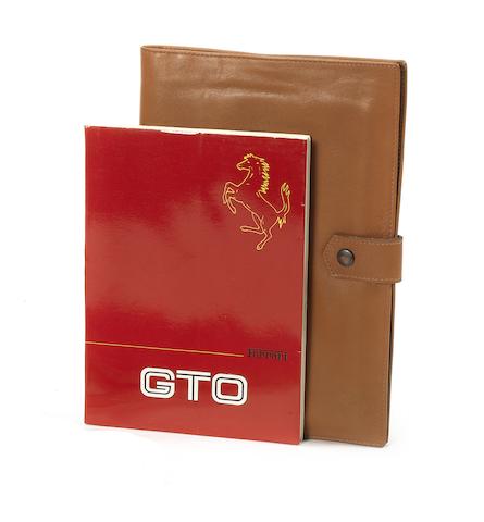 A Ferrari 288 GTO Owner's Manual in leather wallet,   ((2))