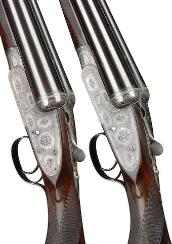 A fine pair of 12-bore single-trigger easy-opening sidelock ejector guns by Boss & Co., no. 6673/4 In their brass-mounted oak and leather case
