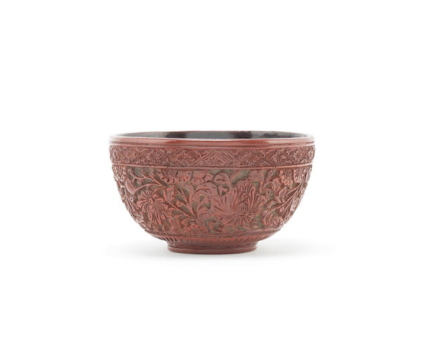 A cinnabar lacquer 'lotus and peony' bowl Possibly Yunnan, 16th century