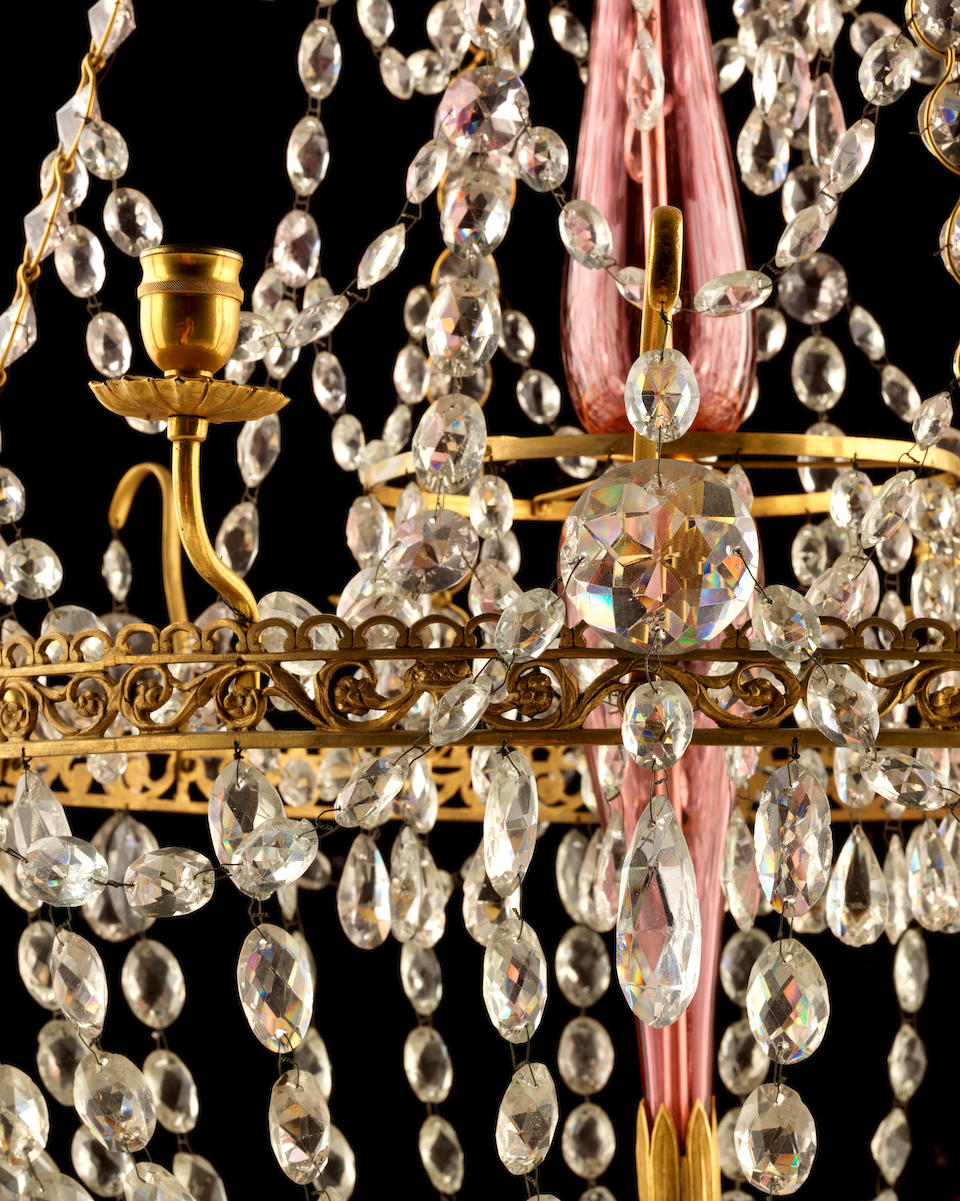 An early 19th century Swedish gilt bronze and pink and clear cut glass eight light chandelier  in the Gustavian manner