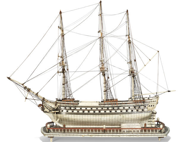 A Napoleonic prisoner-of-war model of the 80-gun ship-of-the-line 'Sans Pariel', early 19th Century,  22 x 28 x 7in (56 x 71 x 18cm). Outer case: 34 x 14 25 1/2in (86 x 35 65cm)