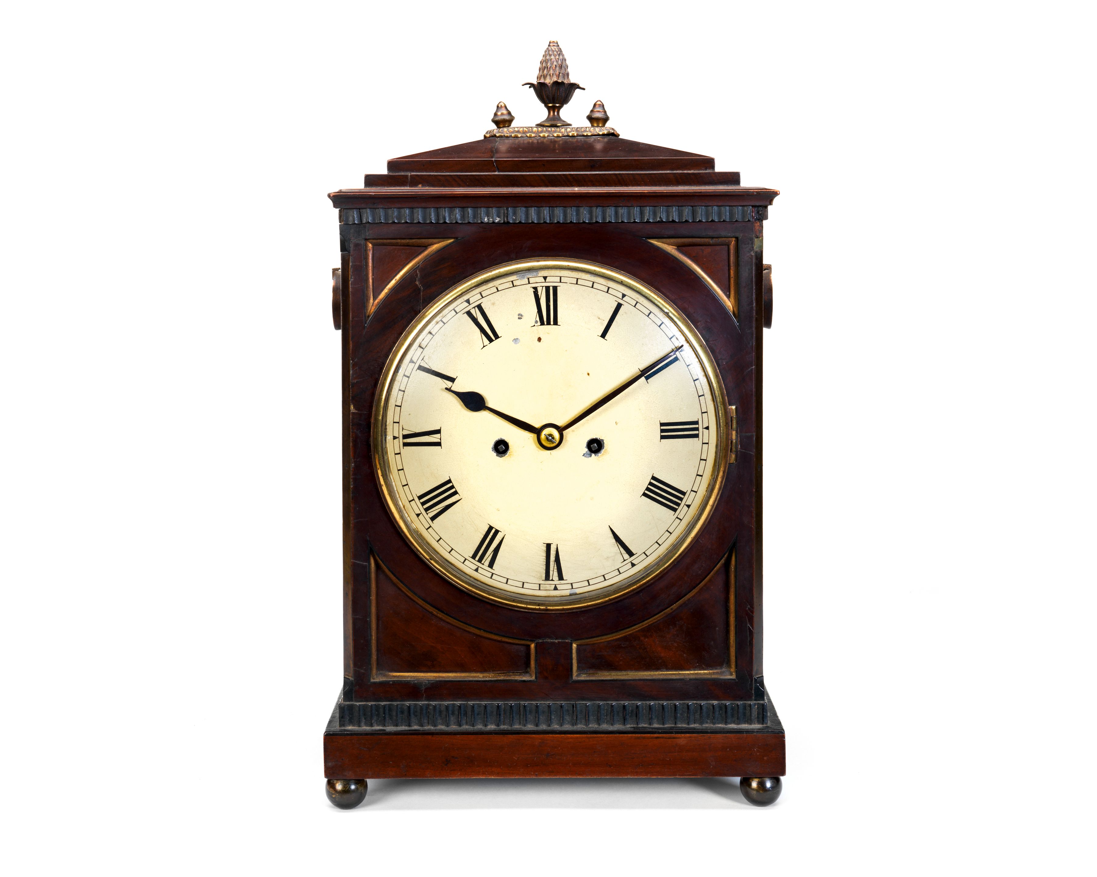 A Regency mahogany table / bracket clock
