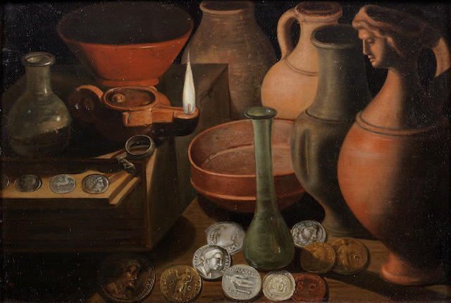 German School, 17th Century Ancient coins, glasswear and pots on a table-top with an oil lamp
