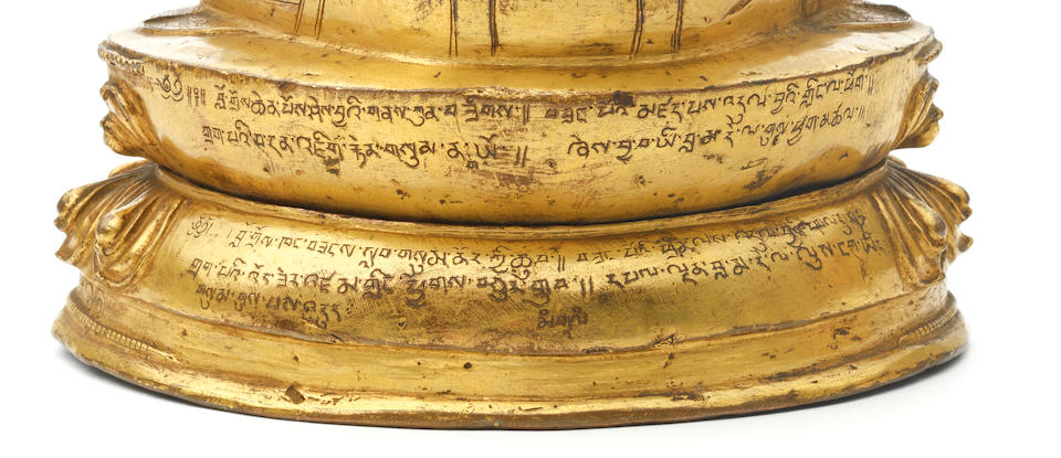 A rare inscribed gilt copper-alloy figure of Tsongkhapa Tibet, circa 15th century