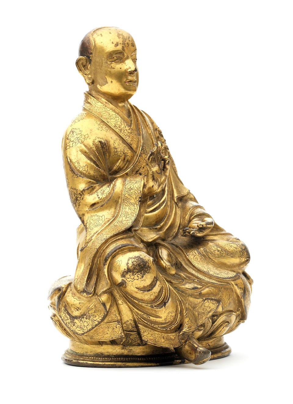 A rare inscribed gilt-copper alloy figure of arhat Bhadra  Tibet, 17th century