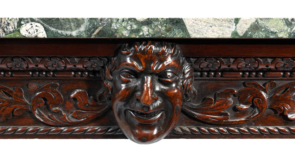 A George III Irish carved mahogany side table