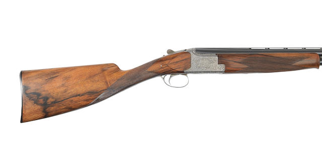 An E. Vos-engraved 12-bore 'Diana Model' single-trigger over-and-under game gun by F.N., no. 863RR65209 In a leather leg-of-mutton case