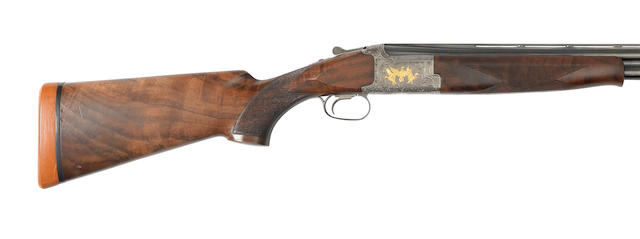 A 12-bore 'Model 425 Grade 6' single-trigger over-and-under ejector gun by Browning, no. 27321PP In a leather slip