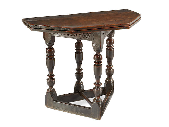 An exceptional Charles I oak folding or credence-type table, circa 1630 - 40