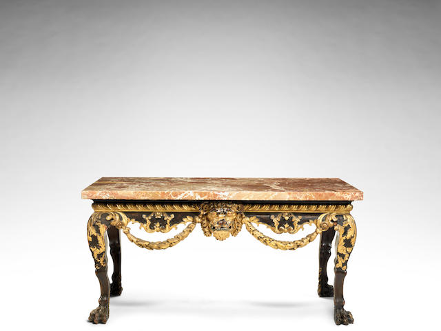 A Victorian mahogany and parcel gilt carved centre table in the George II style