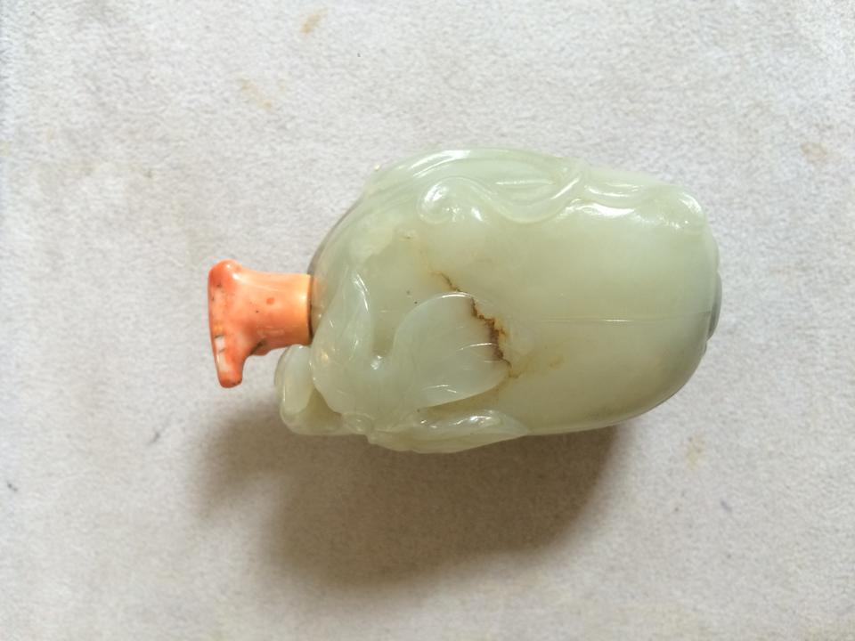 A Chinese carved celadon jade 'gourd' snuff bottle