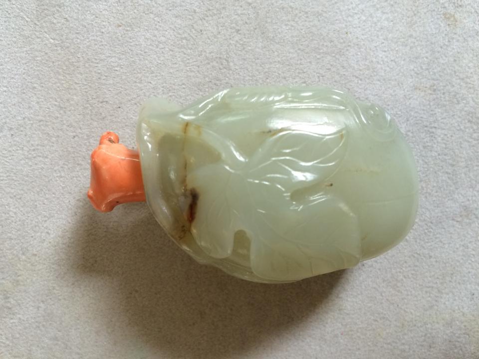 A Chinese carved celadon jade 'gourd' snuff bottle