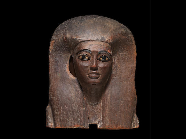 A large Egyptian wood mummy mask