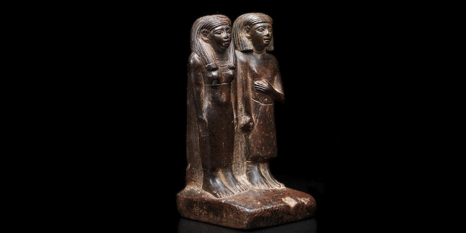 An Egyptian black stone pair statue