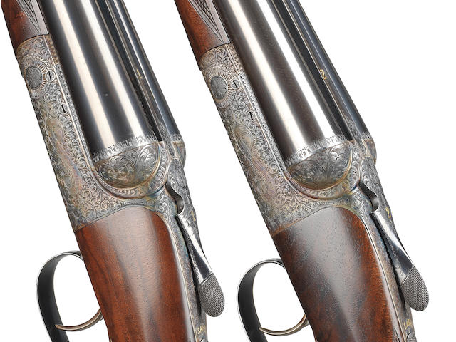 A fine pair of 12-bore round-action ejector guns by David McKay-Brown, no. 7485/6 In their leather motorcase