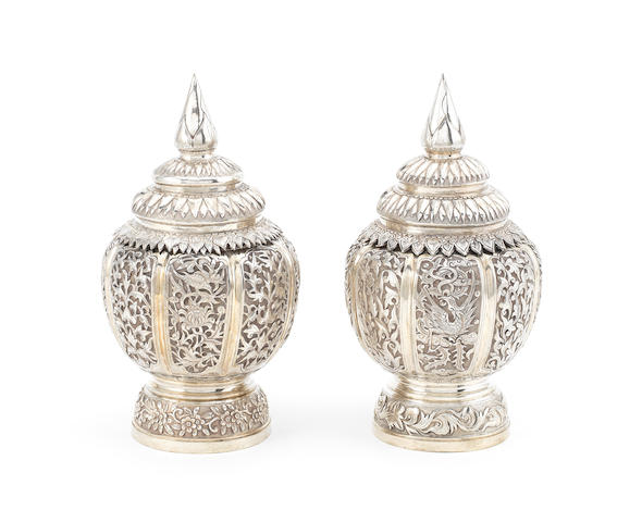 A pair of late 19th century Indochinese silver jars and covers marked on the base with character stamp (2)