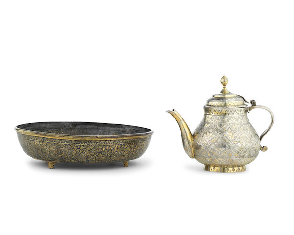 A 19th century Thai silver-gilt and niello dish, together with a silver teapot (2)