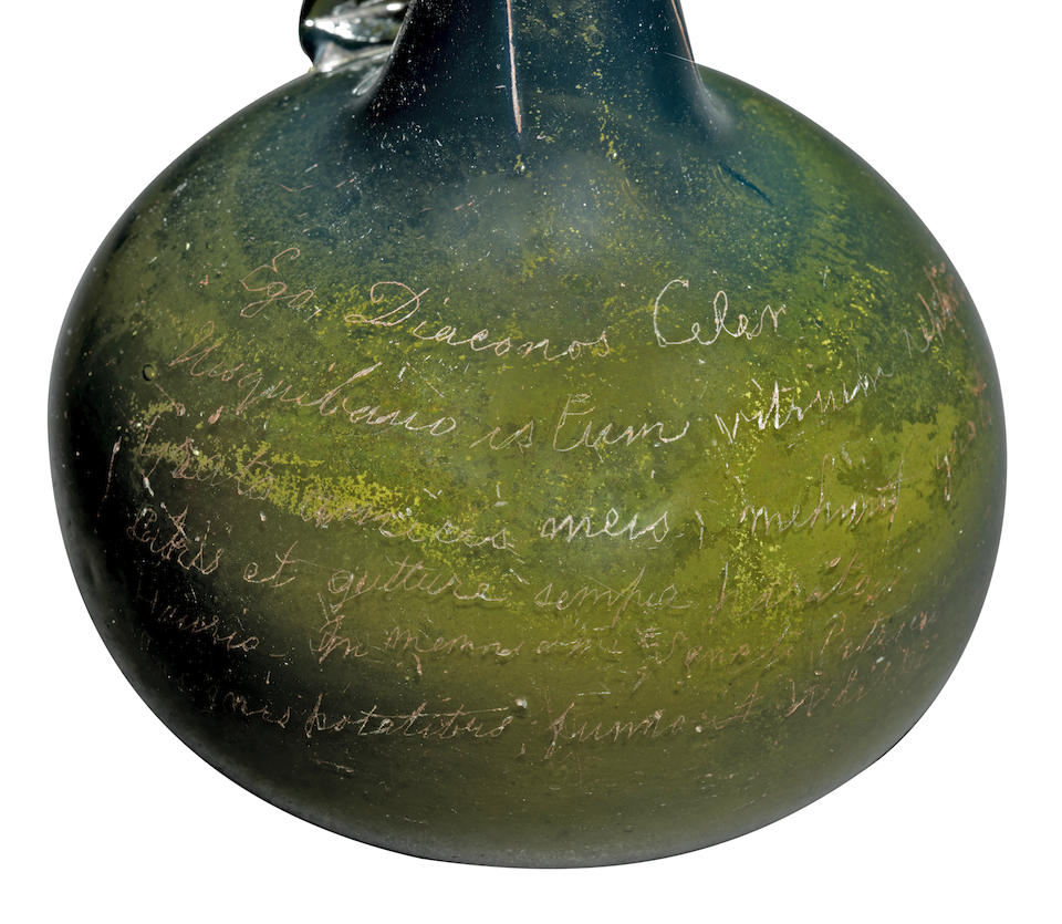 An interesting handled 'onion' serving bottle with a diamond-point inscription, early 18th century