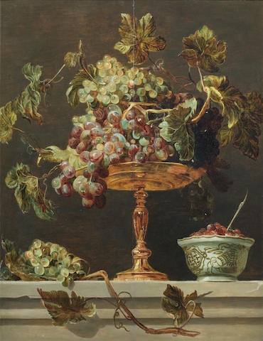Circle of Frans Snyders (Antwerp 1579-1657) A tazza of grapes with a bowl of wild strawberries on a stone ledge
