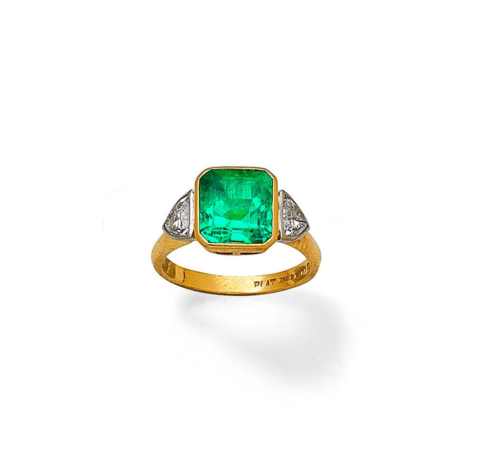 An emerald and diamond ring