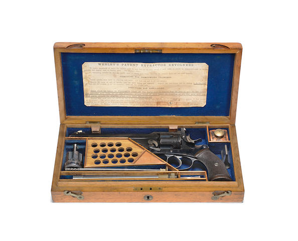 A fine .450/.455 'W.G. Target Model' revolver by P. Webley, no. 8338 In its wooden case with .297/230 cylinder and barrel insert, white metal foresight protector, additional rear-sight blade, some cleaning accessories and cleaning rods for both calibres, the Morris rod lacking the handle