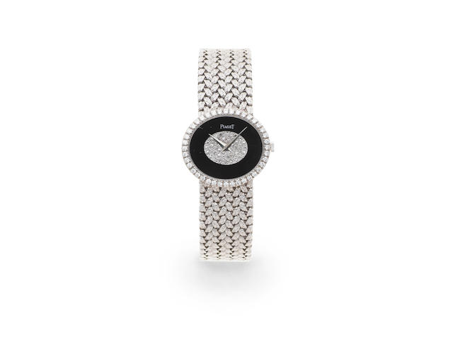 Piaget. A lady's 18K white gold and diamond set manual wind bracelet watch Ref: 9806 D2, Circa 1970