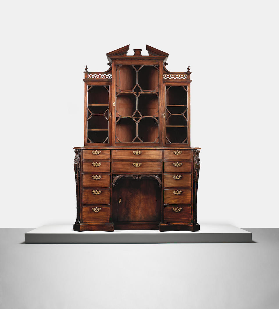 A George III mahogany serpentine display cabinet circa 1760