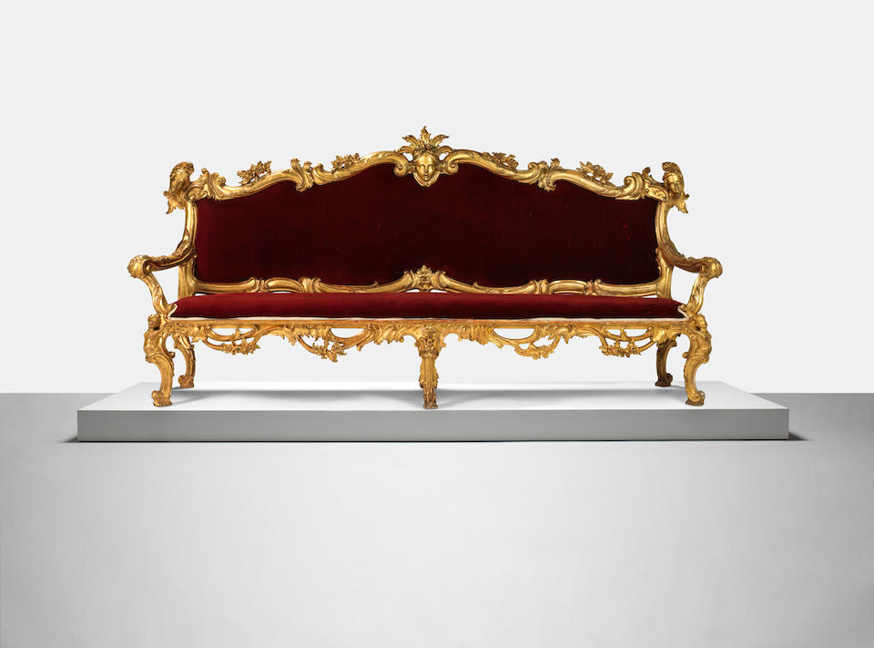 A pair of Italian mid 18th century giltwood 'portego' sofas of Roman origin (2)