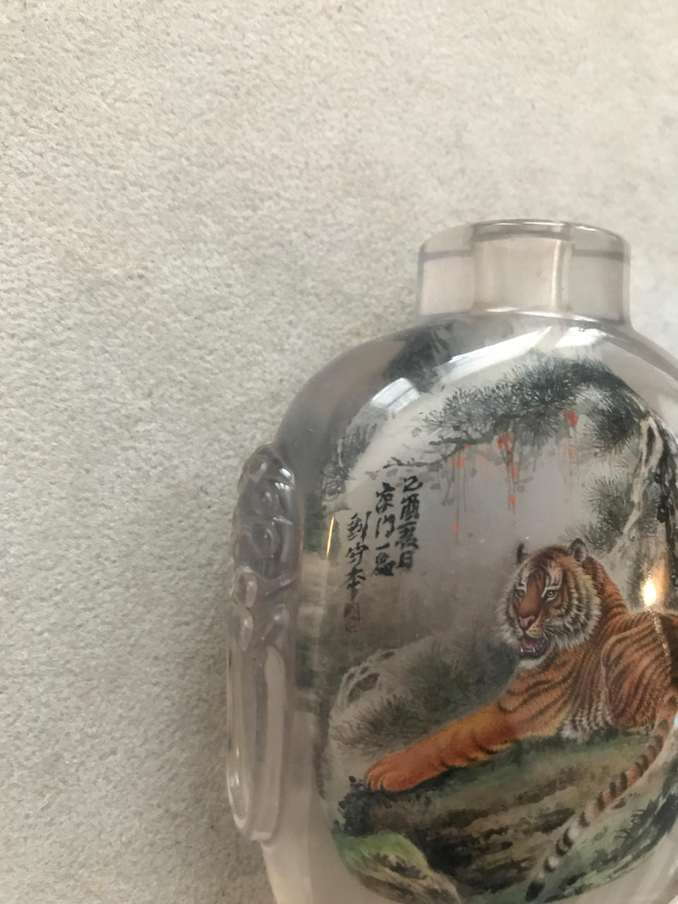 A Chinese inside-painted 'tiger' rock crystal snuff bottle Attributed to Liu Shouben, dated by inscirption 1969