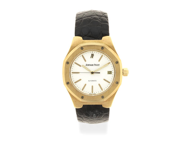 Bonhams : Audemars Piguet. An 18K gold automatic calendar wristwatch ...