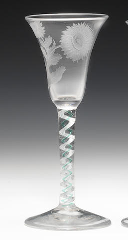 An engraved mixed colour-twist wine glass with a pale green thread, circa 1765