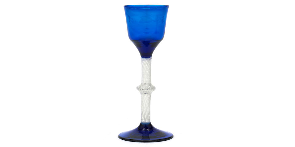 An exceptional opaque-twist wine glass with blue-tinted bowl and foot, circa 1765